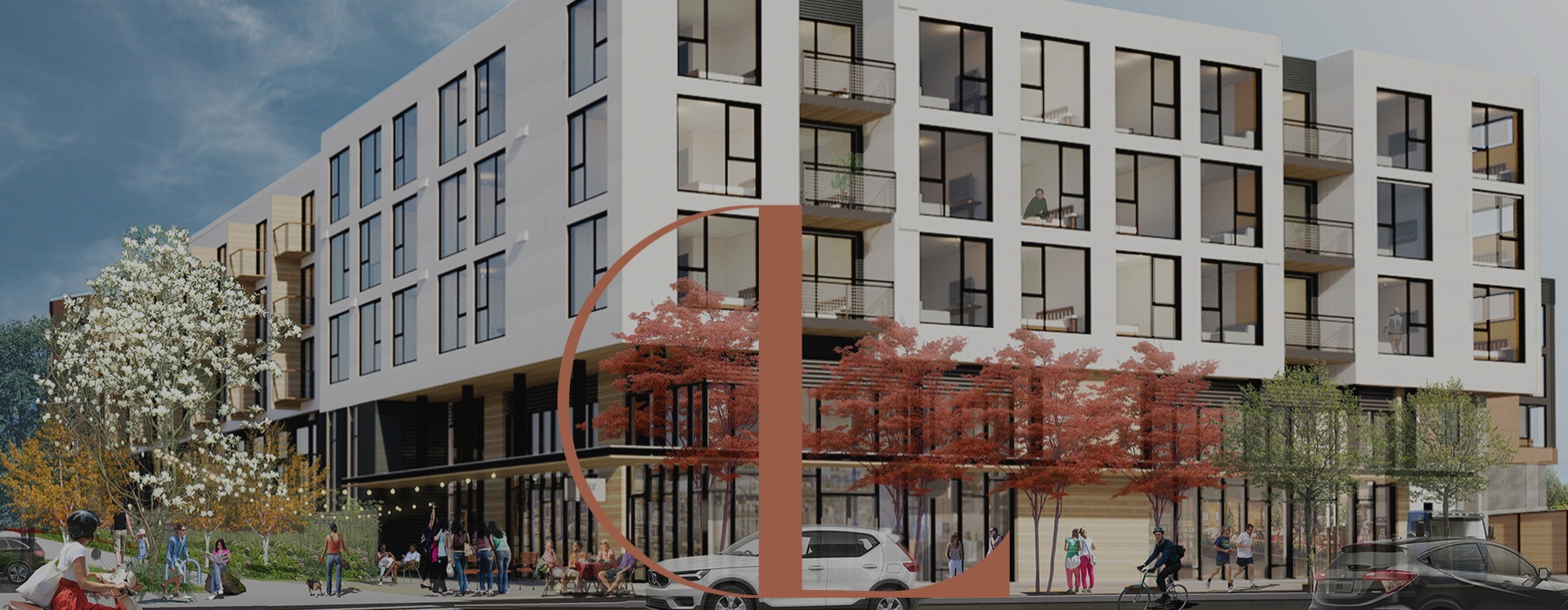 a building with cars driving on a road in front of it